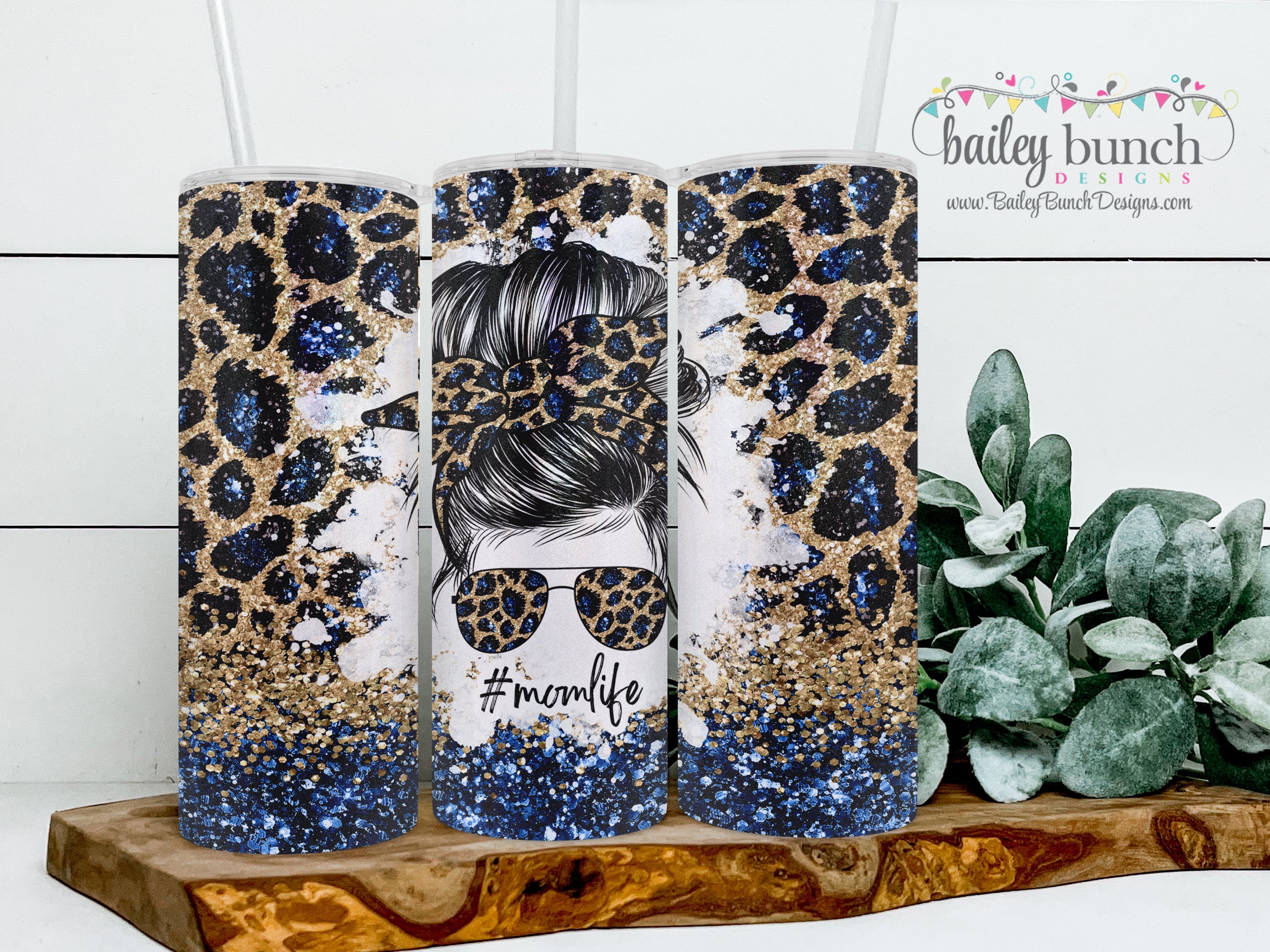 https://www.baileybunchdesigns.com/cdn/shop/files/MomLifeRoyalBlueGoldLeopardPrintMessyBunShimmerTumbler_momlifecopy.jpg?v=1685130876